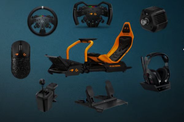 A racing simulator setup featuring a sleek orange seat, steering wheel, pedals, a game controller, gaming mouse, and headphones, all arranged against a dark background, featured in the Logitech McLaren G Challenge Summer Giveaway
