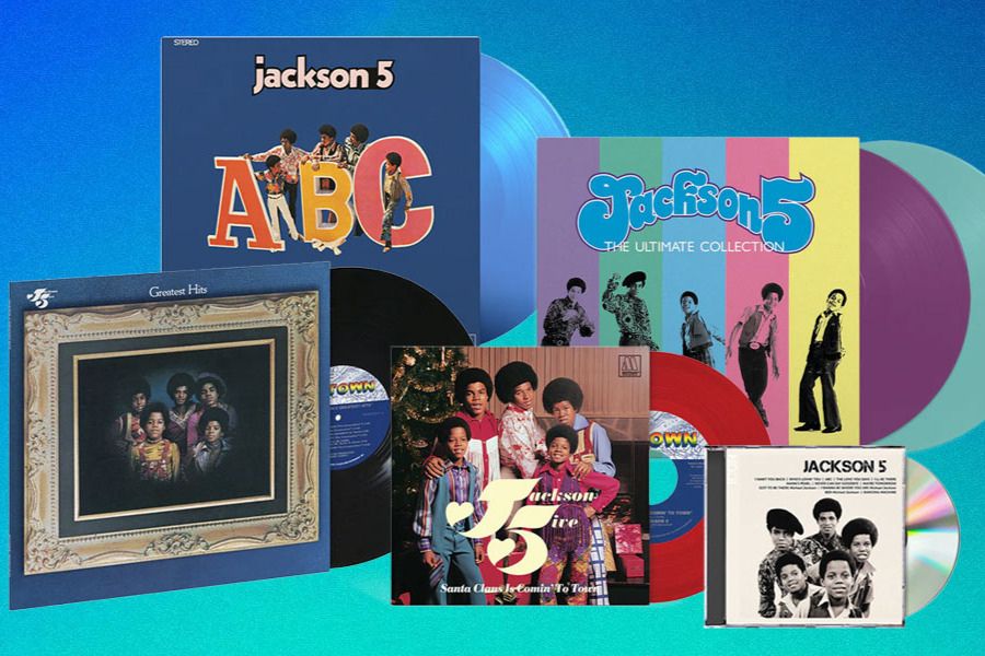 A colorful display of Jackson 5 vinyl records and CDs, showcasing various album artworks, including "ABC" and "Greatest Hits," against a vibrant blue background, featured in the uDiscover Jackson 5 Giveaway