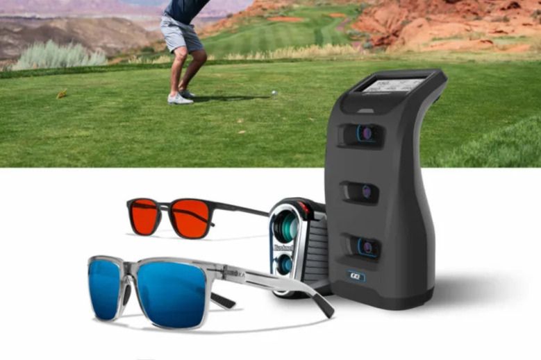 A golfer prepares to swing on a lush green course, while sunglasses and a golf rangefinder are displayed in the foreground, highlighting golfing accessories, featured in the ROKA Foresight GC3 Launch Monitor Sweepstakes