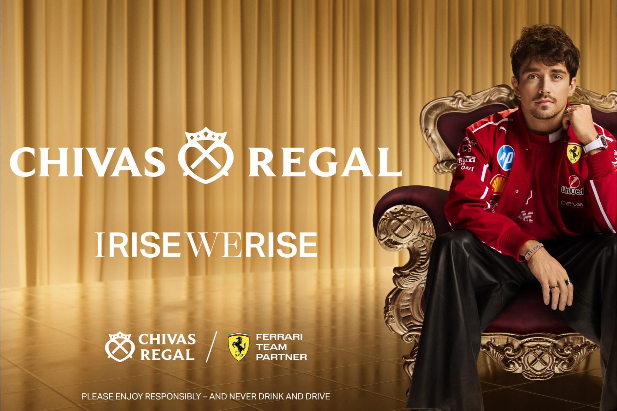 A person in a red racing jacket sits confidently on an ornate chair against a gold curtain backdrop, exuding a stylish and relaxed demeanor, featured in the Chivas Regal Ferrari Sweepstakes