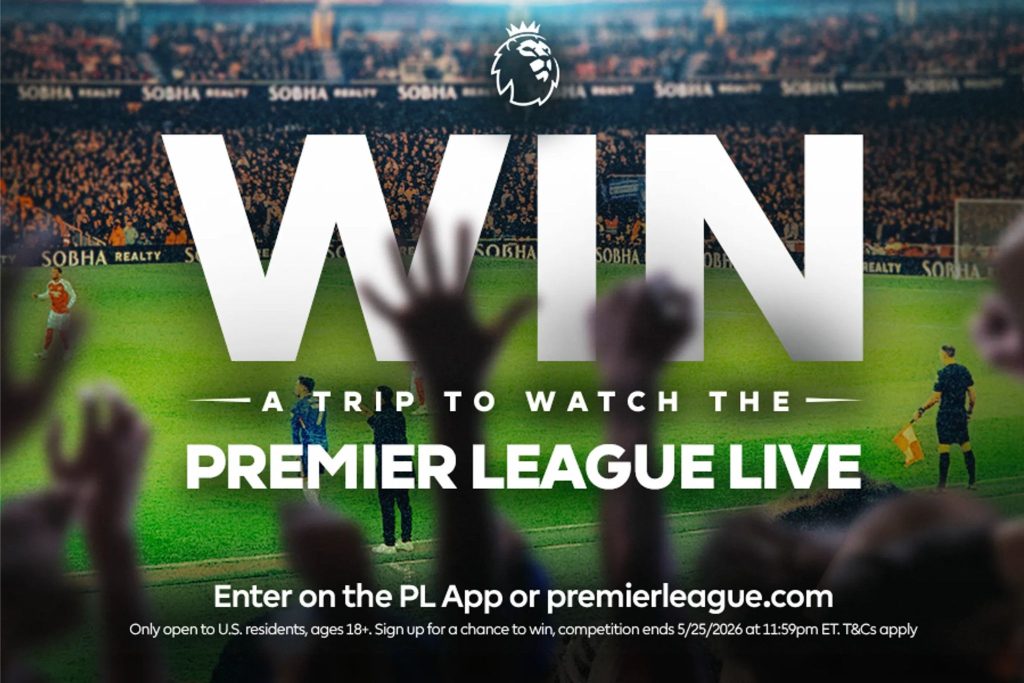 A cheering crowd raises their hands in excitement at a lively football match, with players and referees visible on the field, creating a vibrant sports atmosphere, featured in the Premier League Trip Sweepstakes