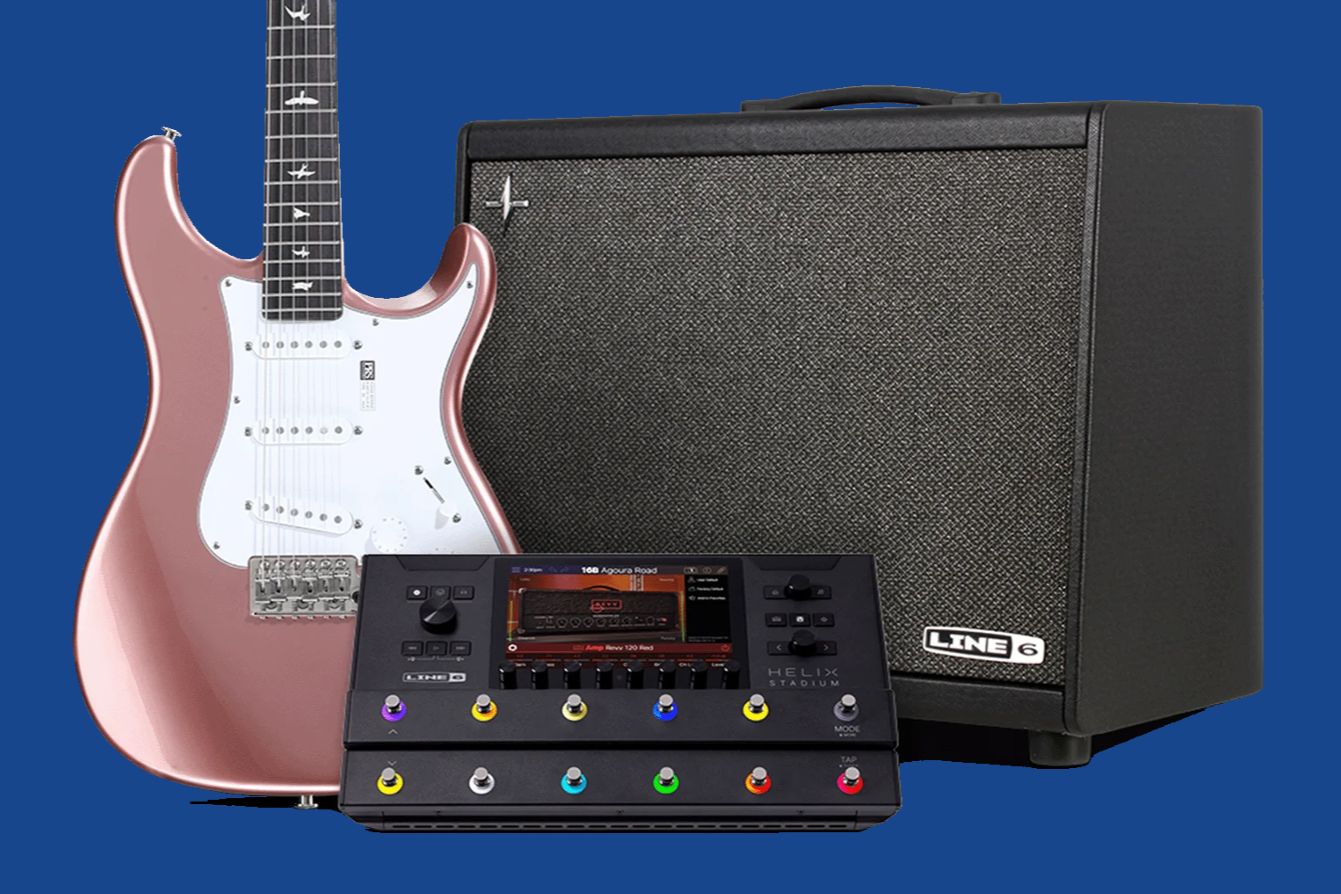 A pink electric guitar stands beside a black amplifier and a multi-effect processor on a blue background, showcasing a complete setup for musicians, featured in the Sweetwater PRS Line 6 Giveaway