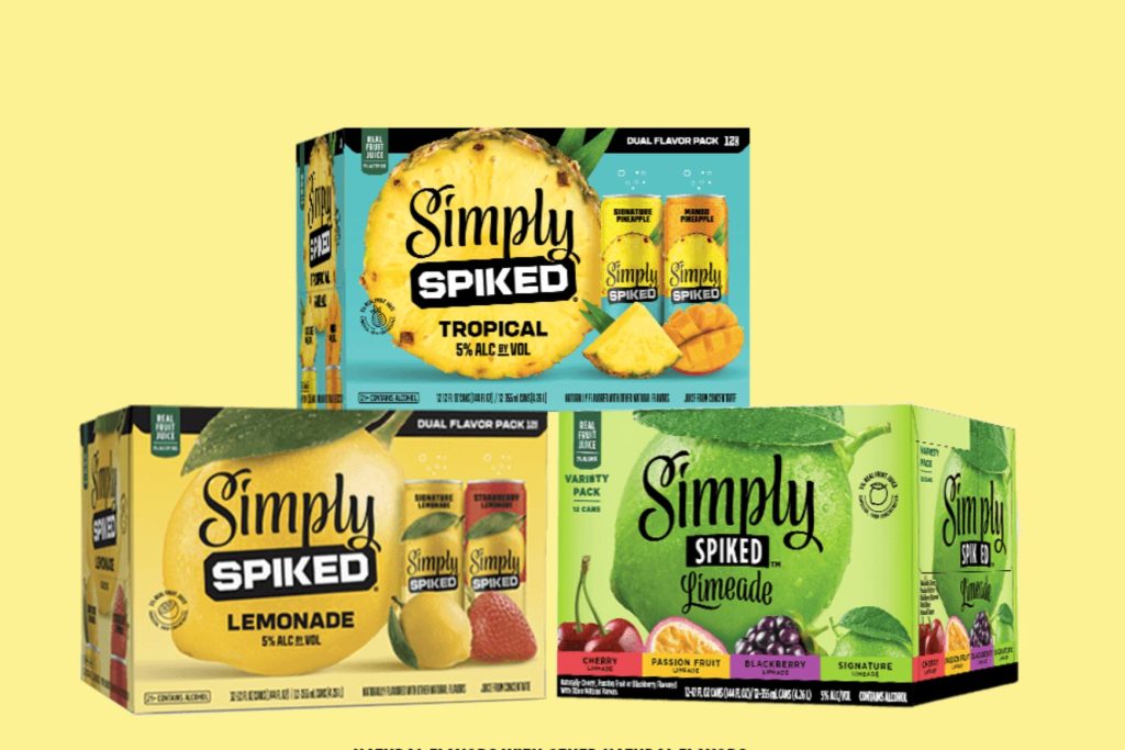 Three colorful packs of Simply Spiked beverages, featuring tropical, lemonade, and limeade flavors, are displayed against a bright yellow background, featured in the Simply Spiked Lemon Grill Sweepstakes