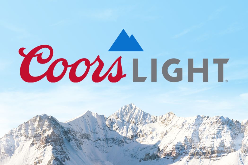Snow-capped mountains rise against a clear blue sky, showcasing a serene winter landscape, evoking a sense of adventure and connection to nature, featured in the Coors Light The Perfect Match Soccer Watch Party Sweepstakes