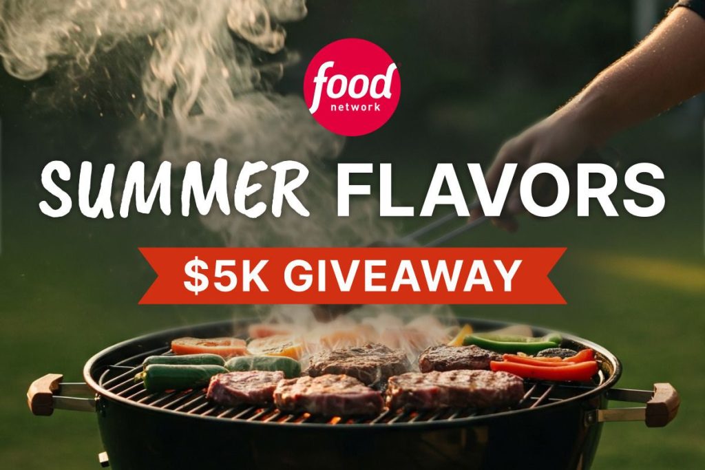 A close-up of a grill filled with sizzling steaks and colorful vegetables, as smoke rises into the air. A hand holds tongs, ready to flip the food on a sunny day, featured in the Food Network $5,000 Sweepstakes