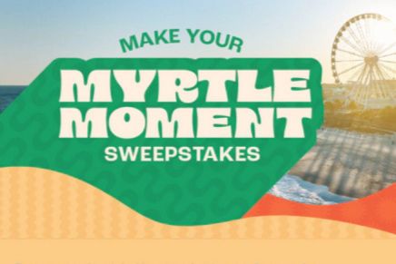 A coastal scene featuring a beach with waves and a ferris wheel in the background, highlighting an opportunity for a special experience or giveaway associated with Myrtle Beach, featured in the Make Your Myrtle Moment Sweepstakes