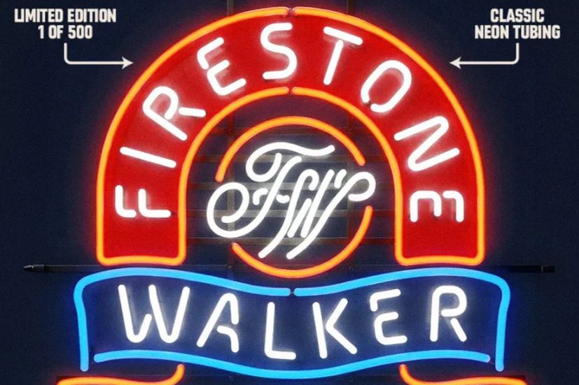 A vibrant neon sign features the words "Firestone Walker" illuminated in red and blue, showcasing a stylish design typical of classic neon art, featured in the Firestone Walker Neon Sign Sweepstakes