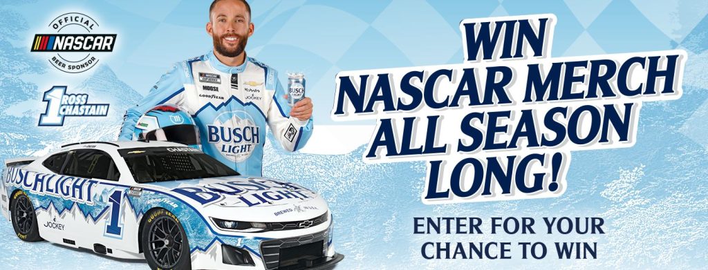 A smiling man in a blue racing suit holds a can while standing beside a white race car decorated in blue and white. The background features a light blue design, evoking a festive atmosphere, featured in the Busch Racing Sweepstakes