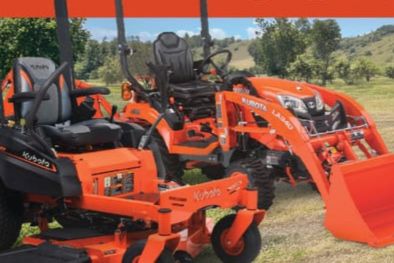 A scene featuring two orange agricultural machines in a grassy field, showcasing a compact tractor with a loader and a riding lawn mower surrounded by trees and rolling hills, featured in the Kubota Tractor Sweepstakes