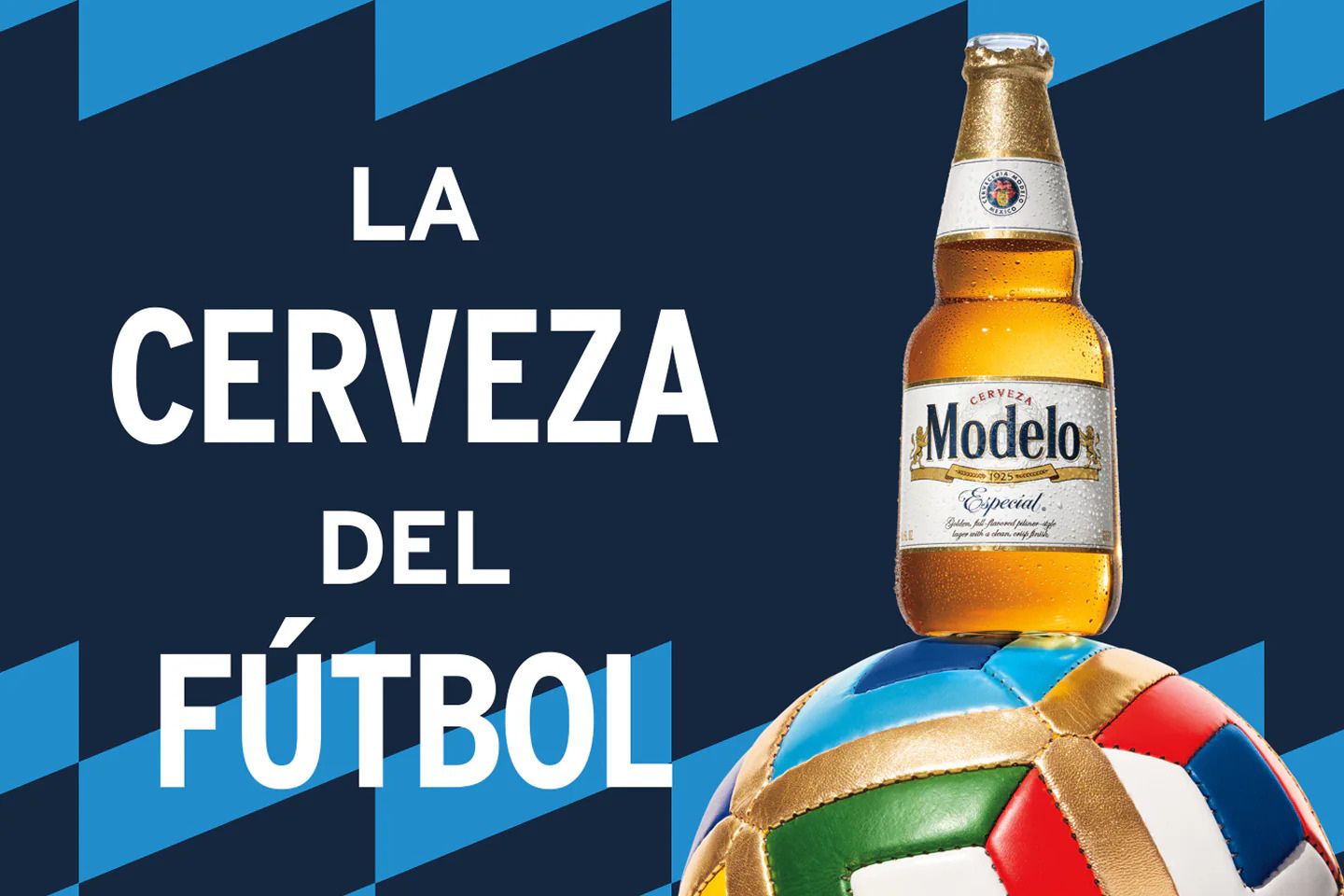 A chilled bottle of beer rests atop a colorful soccer ball. The background features a dark color, enhancing the vibrant hues of the ball and the bottle's golden contents, featured in the Modelo Soccer Ball Sweepstakes