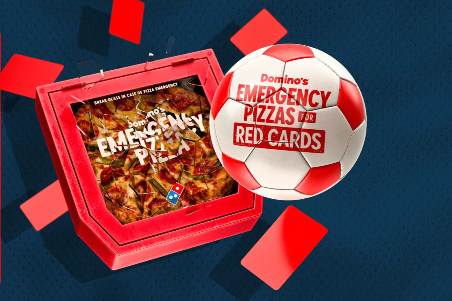 A broken pizza box with a pizza inside is displayed alongside a soccer ball featuring a red and white design, with red cards scattered in the background, suggesting a playful soccer theme, featured in the Domino's Emergency Pizza Red Card Sweepstakes
