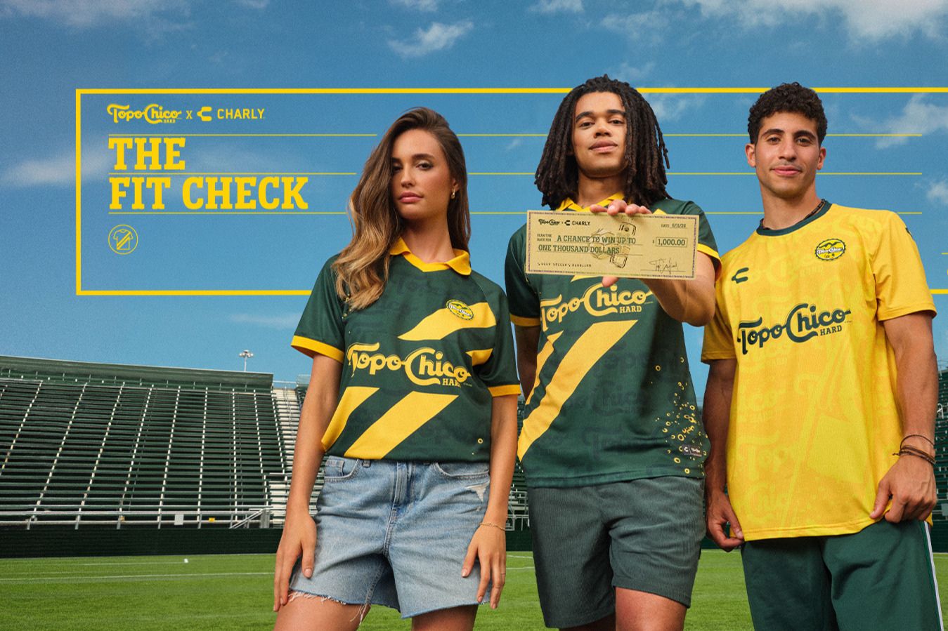 Three young adults stand on a sports field, showcasing vibrant jerseys. The woman wears denim shorts and a green shirt, while the men wear yellow and green jerseys, holding a cash prize, featured in the Topo Chico Hard $1,000 Sweepstakes