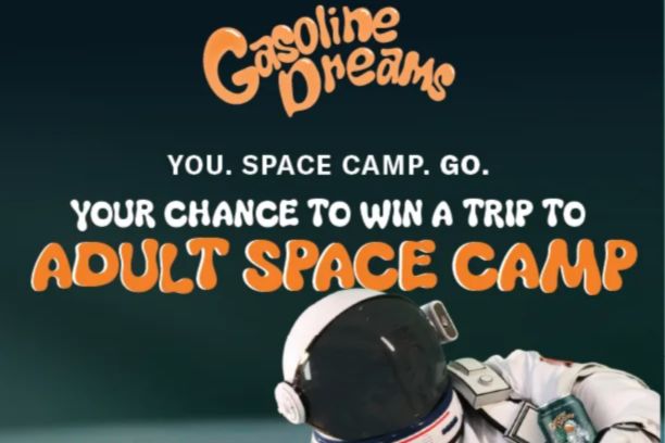 An astronaut in a space suit prepares for space camp, with a vibrant background. The design conveys excitement for a chance to win an adult space camp experience, featured in the Monday Night Brewing Space Camp Sweepstakes