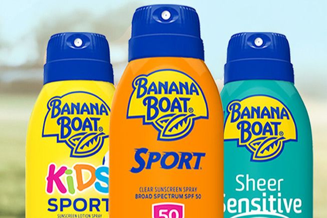 Three bottles of sunscreen are displayed, featuring vibrant packaging in yellow, orange, and green. The products are designed for kids, sport, and sensitive skin, set against a blurred outdoor background, featured in the Swing into Summer Sweepstakes