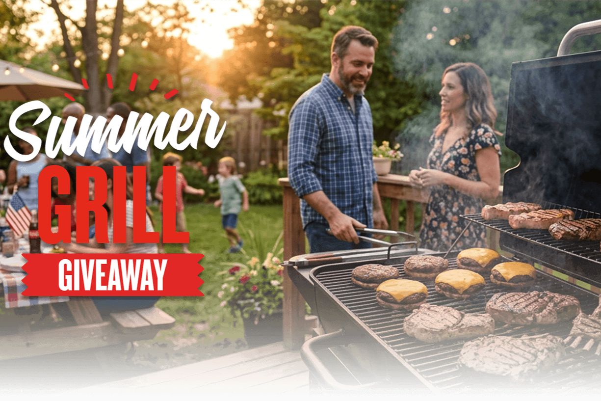 A man and woman chat joyfully by a grill filled with sizzling steaks and burgers during a summer gathering, while children play in a sunlit backyard, featured in the IGA Grill Sweepstakes