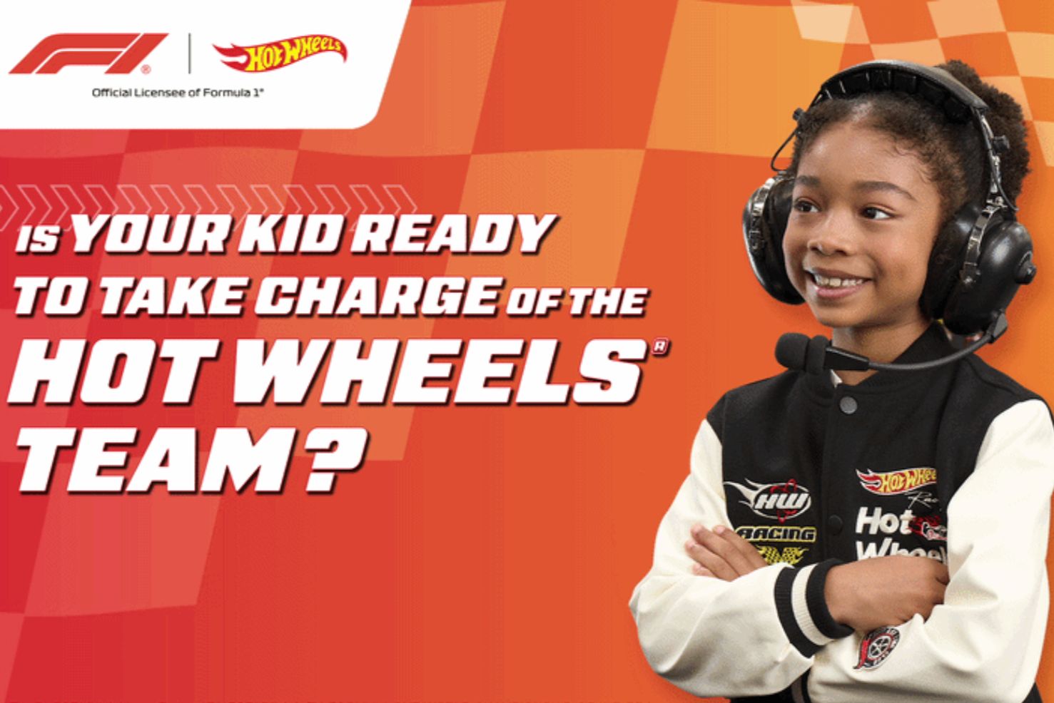 A confident child wearing a black and white racing jacket and headphones smiles while crossing arms, ready to lead a team, set against a vibrant orange background, featured in the Mattel Hot Wheels Team Principal Sweepstakes